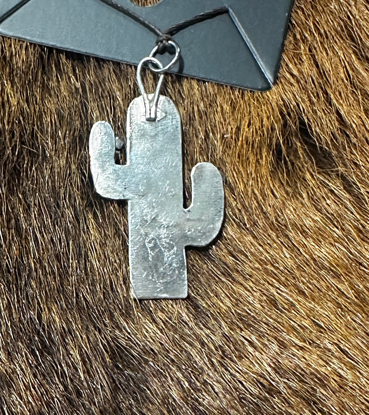 Sterling silver saguaro cactus pendant featuring Kingman turquoise and coral stone.
