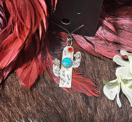 Sterling silver saguaro cactus pendant featuring Kingman turquoise and coral stone.
