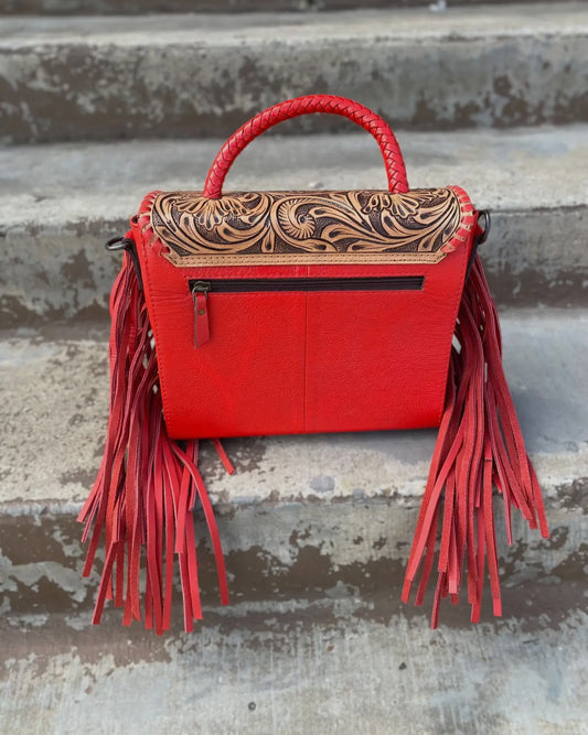 Red Tooled Leather Crossbody bag with tooled leather strap.