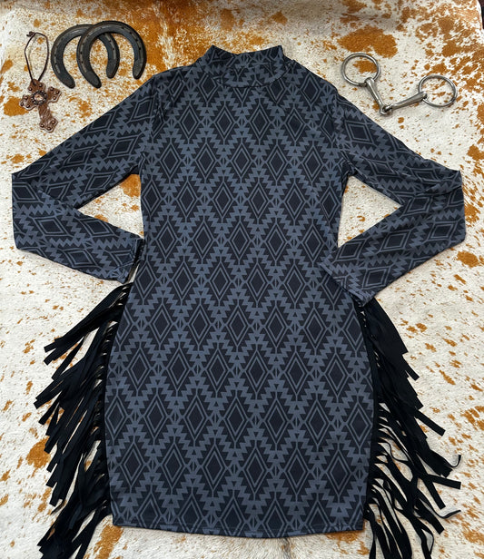BLACK AZTEC LONG SLEEVE DRESS WITH SIDE FRINGE. Please note the dress the model has on is a different color, see next picture for color reference. The dress is black. Click on the picture for sizing options. **sale was 38.00 NOW 20.00