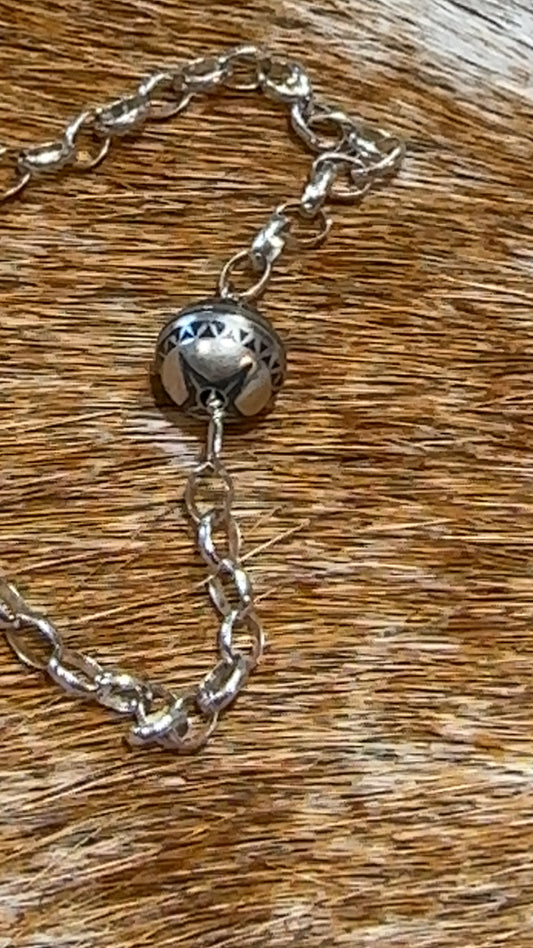 Sterling chain with a melon bead ornament with a squash blossom bead.