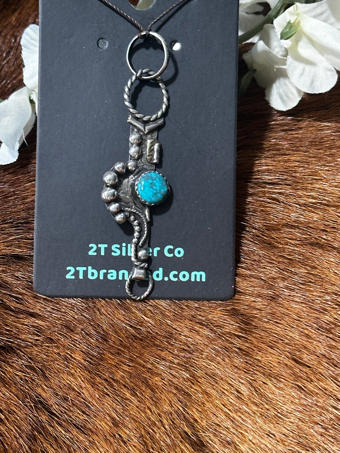 Custom one-of-a-kind Spade Bit cheek Pendant.