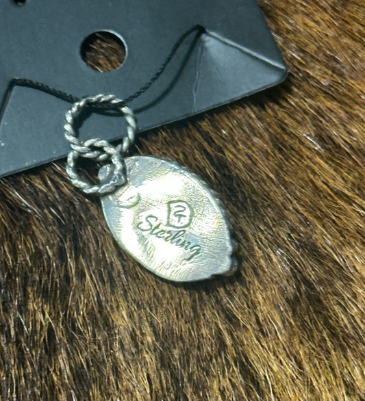 Sterling silver pendant featuring a genuine, highly matrixed turquoise stone.