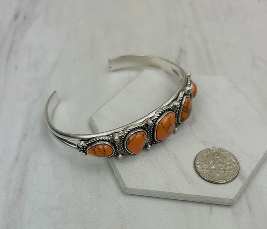 Silver Metal
with Orange Turquoise Stone Bangle