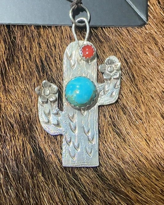 Sterling silver saguaro cactus pendant featuring Kingman turquoise and coral stone.