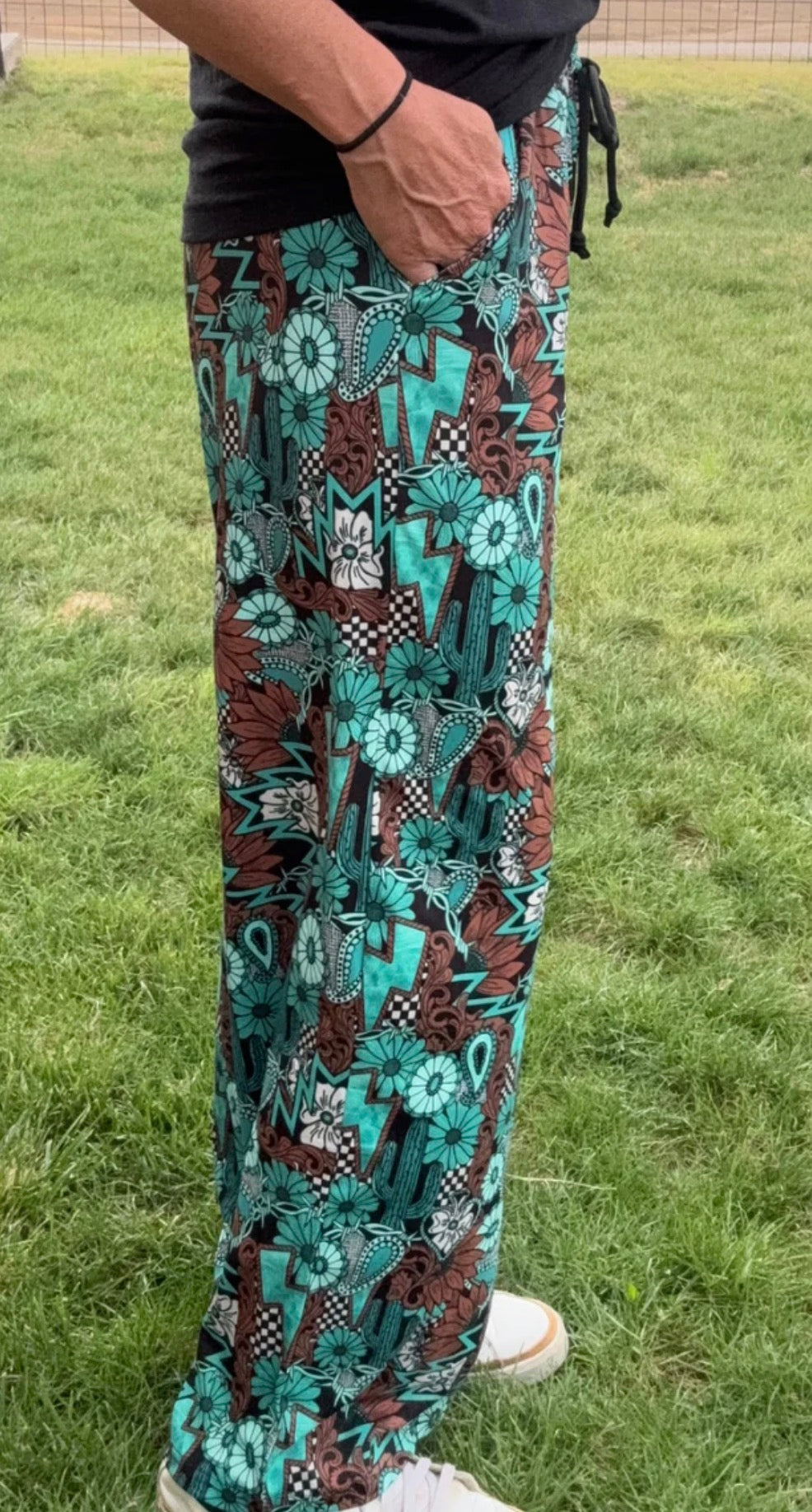 TATTOOS IN TURQUOISE PANTS