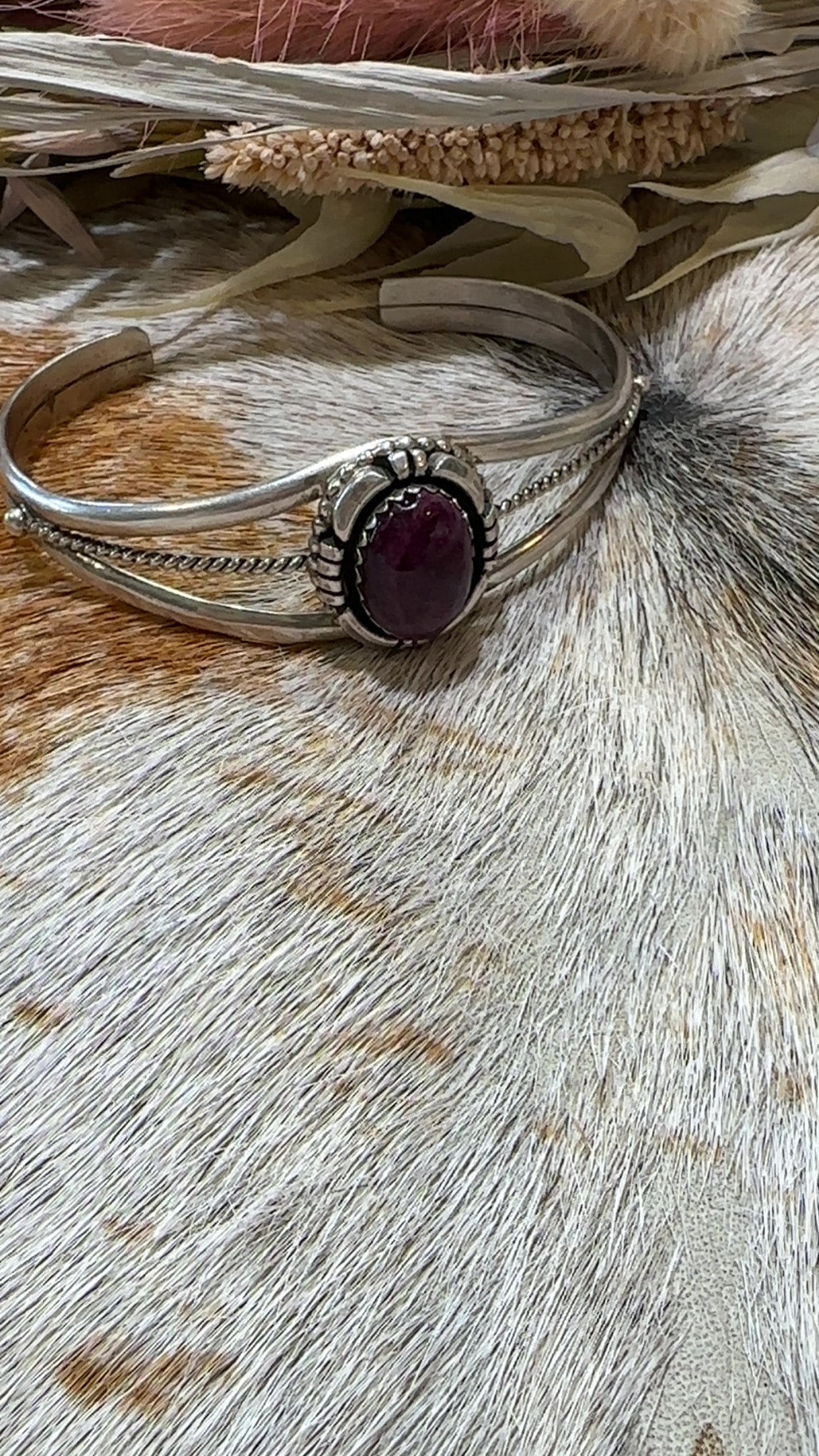 Authentic Stamped Navajo sterling silver cuff bracelet featuring a purple spiny oyster stone. 