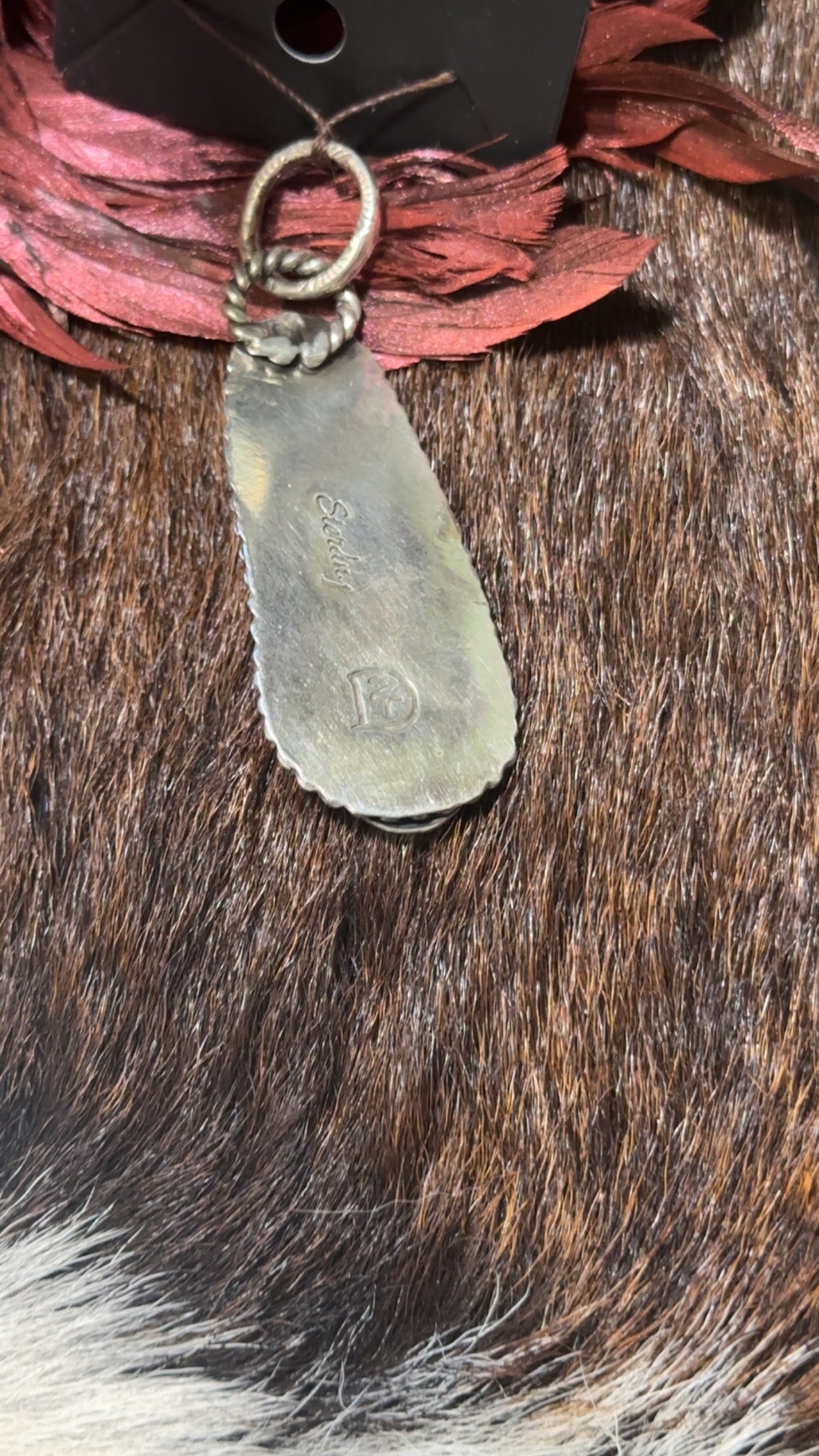 Genuine turquoise and sterling silver Southwest-style pendant