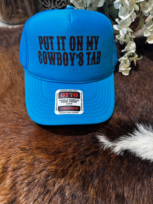 “Put it on my cowboys tab” teal trucker hat