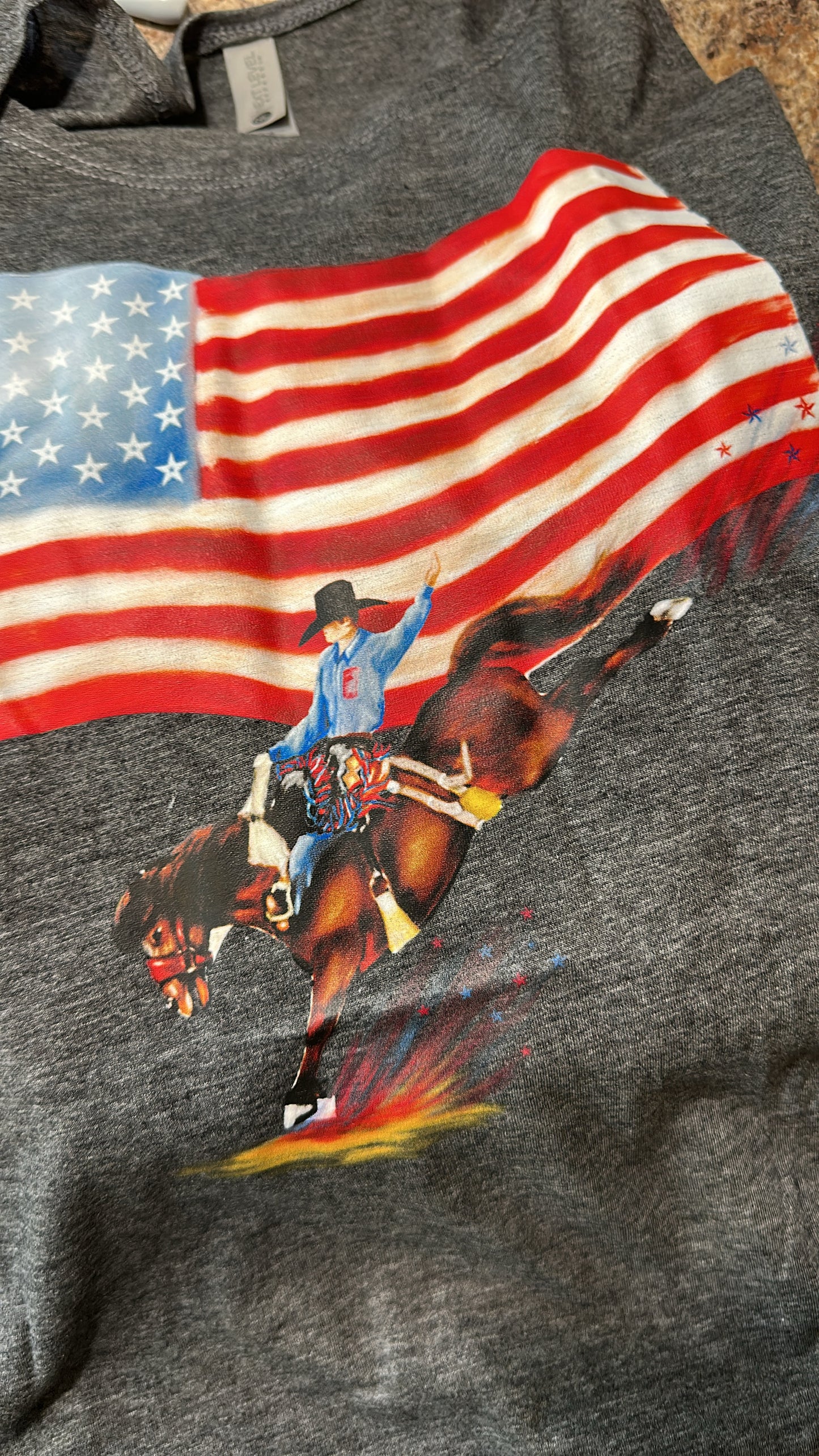 Stars Stripes & Rodeo Rides| Western
Graphic Tank **please note that it is a touch of a lighter gray than the picture* Referred to picture number two to see the color. ￼
